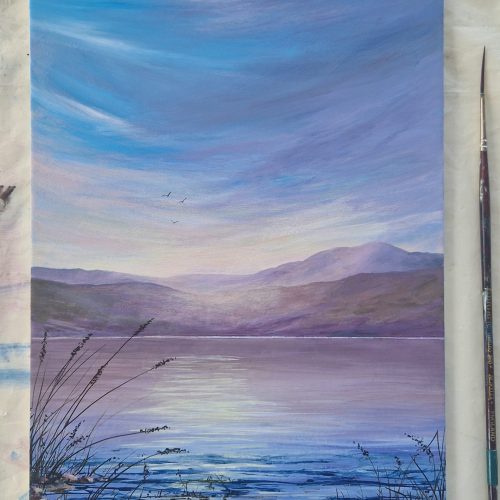 Soft Haze is an atmospheric acrylic painting. The sky is reflecting in the water with softly coloured hills in the distance.